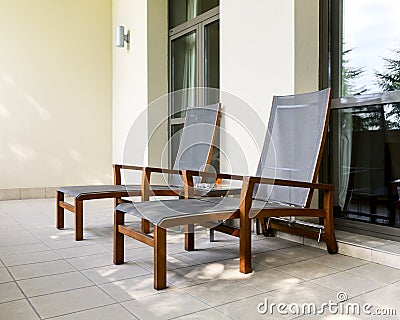 Two chaise longue on balcony Stock Photo