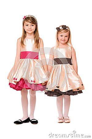 Two charming little girls in a dress Stock Photo