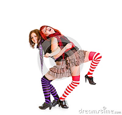 Two cheerful girlfriends funny posing together Stock Photo