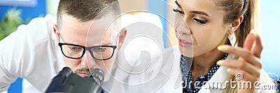 Two chemists on meet against chemistry lab background. Stock Photo