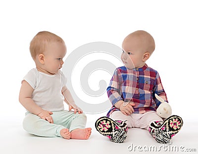 Two child baby girls toddlers sitting Stock Photo