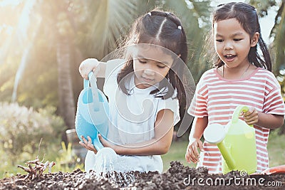 Two children asian little girl having fun to prepare soil Stock Photo