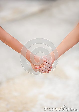 Two little children holding hands. the concept of friendship and love. helping children and others Stock Photo