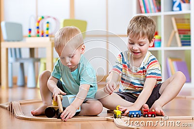 Two children little boys playing role game in daycare Stock Photo