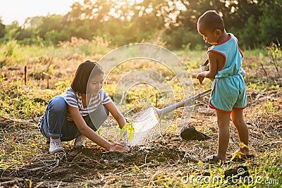 Two children planting trees to save the world.eco environment Stock Photo