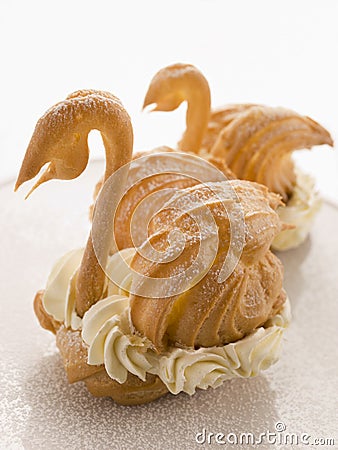 Two Choux Swans filled with Chantilly Cream Stock Photo