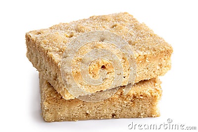 Two classic homemade square shortbread biscuits stacked and isolated on white. Stock Photo