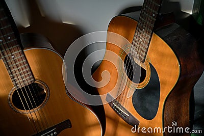 Two classical guitars by the wall Stock Photo