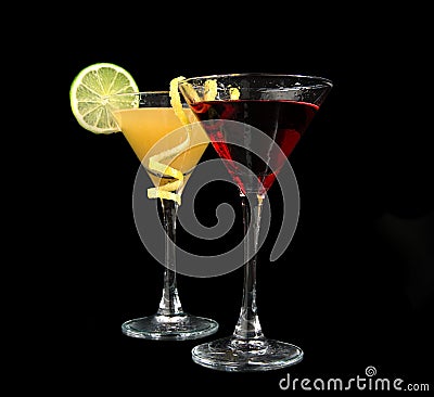 Two cocktails cosmopolitan cocktails decorated with citrus lemon twist yellow Stock Photo