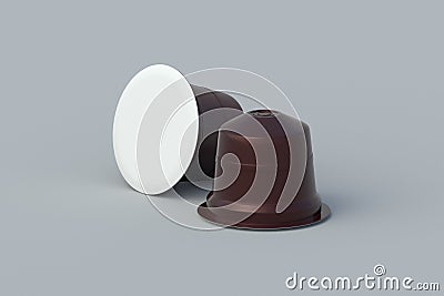 Two coffee capsules on gray background. Modern decaf pods for machine. Stock Photo