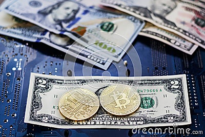 . two coins bitcoin lie on two bucks. Bitcoin drop to such a low price. collapse failure Stock Photo