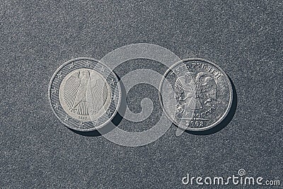 Euro and ruble coins rear sides up Stock Photo