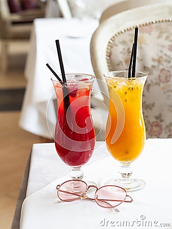 Two cold lemonades berry and passion fruit . Drink with ice. Stock Photo