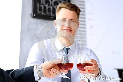 Two colleagues celebrate signing a contract with Whisky Stock Photo