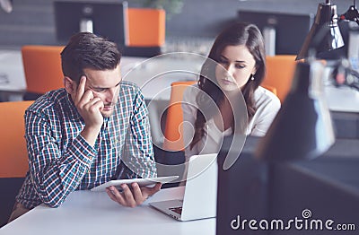 Young Casual business couple using computer in the office. Coworking, Creative manager showing new startup idea Stock Photo