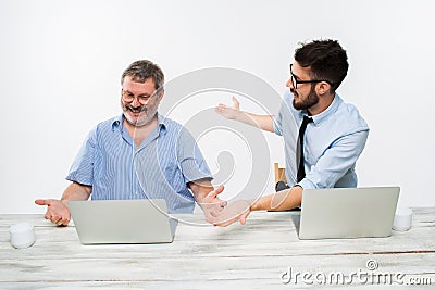 The two colleagues working together at office on white background Stock Photo