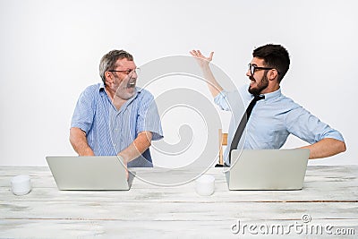 The two colleagues working together at office on white background Stock Photo