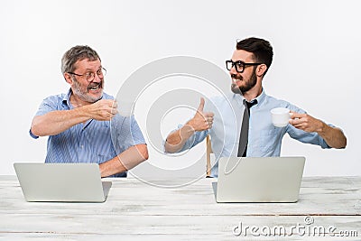 The two colleagues working together at office on white background Stock Photo