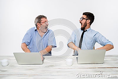 The two colleagues working together at office on white background Stock Photo