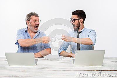 The two colleagues working together at office on white background Stock Photo