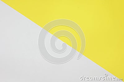 Two color paper with Yellow and white Overlap on the floor And split half of the image Stock Photo