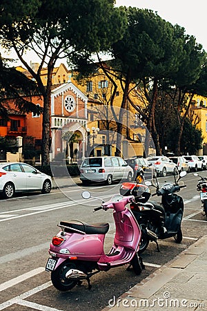 Two color scooters in Italy Editorial Stock Photo