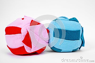 Two colorful soft textile washable snuffle toy balls with special holes inside for treats for dog nose work, close up Stock Photo