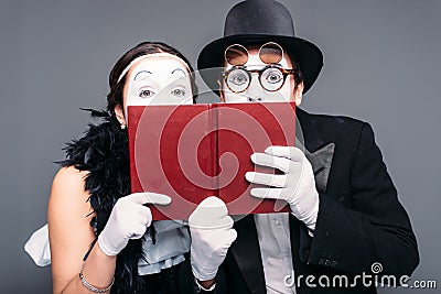 Two comedy performers posing with book Stock Photo