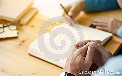Two confident students doing homework together while sitting at the home or class room, selective focus Stock Photo
