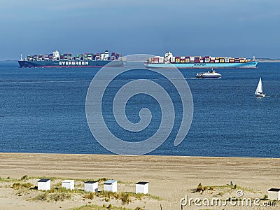 Two containerships Evergreen and Maersk in the estuary of the Scheldt river in Netherlands Editorial Stock Photo