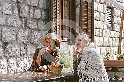 Two Contryside friends eating apple and smile Stock Photo