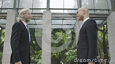 Corporate business people talking in building lobby Stock Photo