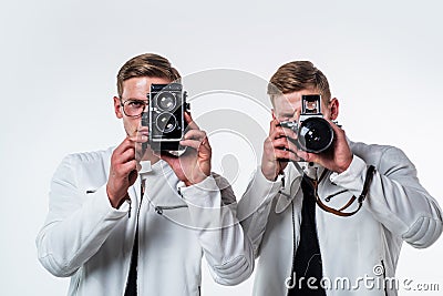 two cousin with retro photo camera. young confident brothers. confident model photographer Stock Photo