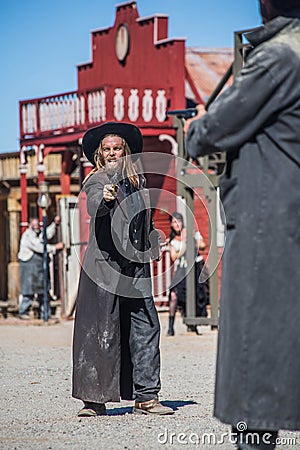 Two Cowboys Duel in Town Stock Photo