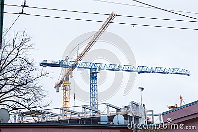 Two cranes and building. Industrial teritory, urban city view. Travel photo 2019 Editorial Stock Photo