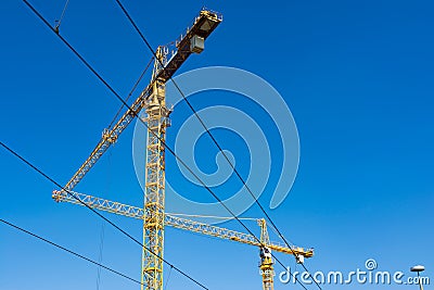 Two Cranes Pointed Toward Each Other Triangle Construction Stock Photo