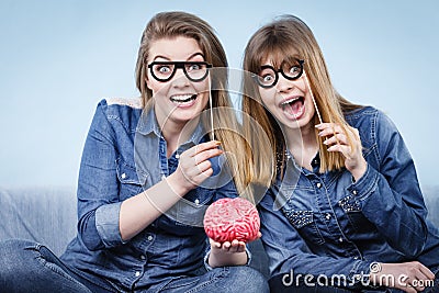 Two crazy women friends thinking Stock Photo