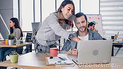 Two of creative designer casual meeting with laptop at modern office in morning at desk.casual workplace lifestyle Stock Photo