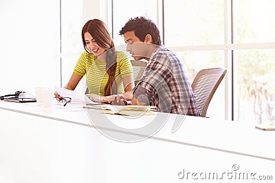 Two Creatives Working Together In Design Studio Stock Photo