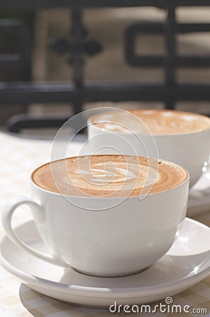 Two cups of cappuccino. Stock Photo