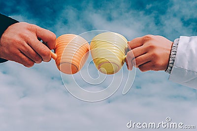 Two cups of coffee in the hands of in love couple. winter theme Stock Photo