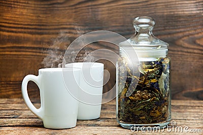 Two cups. Herbal aromatic tea. On a wooden table Stock Photo