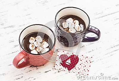 Two cups of hot chocolate with marshmallows and Valentine's day postcard Stock Photo