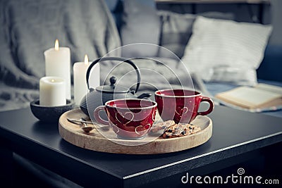 Two cups of tea on a serving tray on coffee table Stock Photo