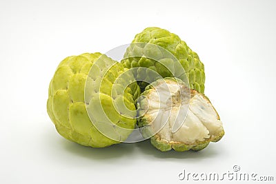 Two custard apples and one half custard apple, isolated on background. Stock Photo