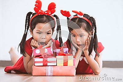 Two cute asian child girls surprise with gift boxes Stock Photo