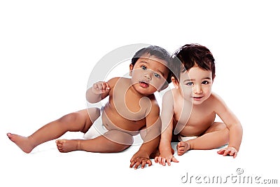 Two cute babies sitting together Stock Photo