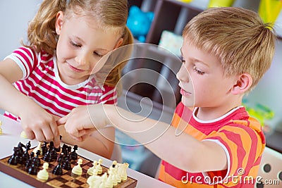 Two cute children plaing chess Stock Photo