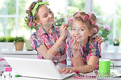 Cute little girls beautifying themselves Stock Photo