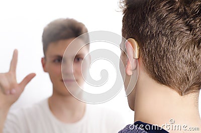 Two deaf-mute teenagers communicating Stock Photo